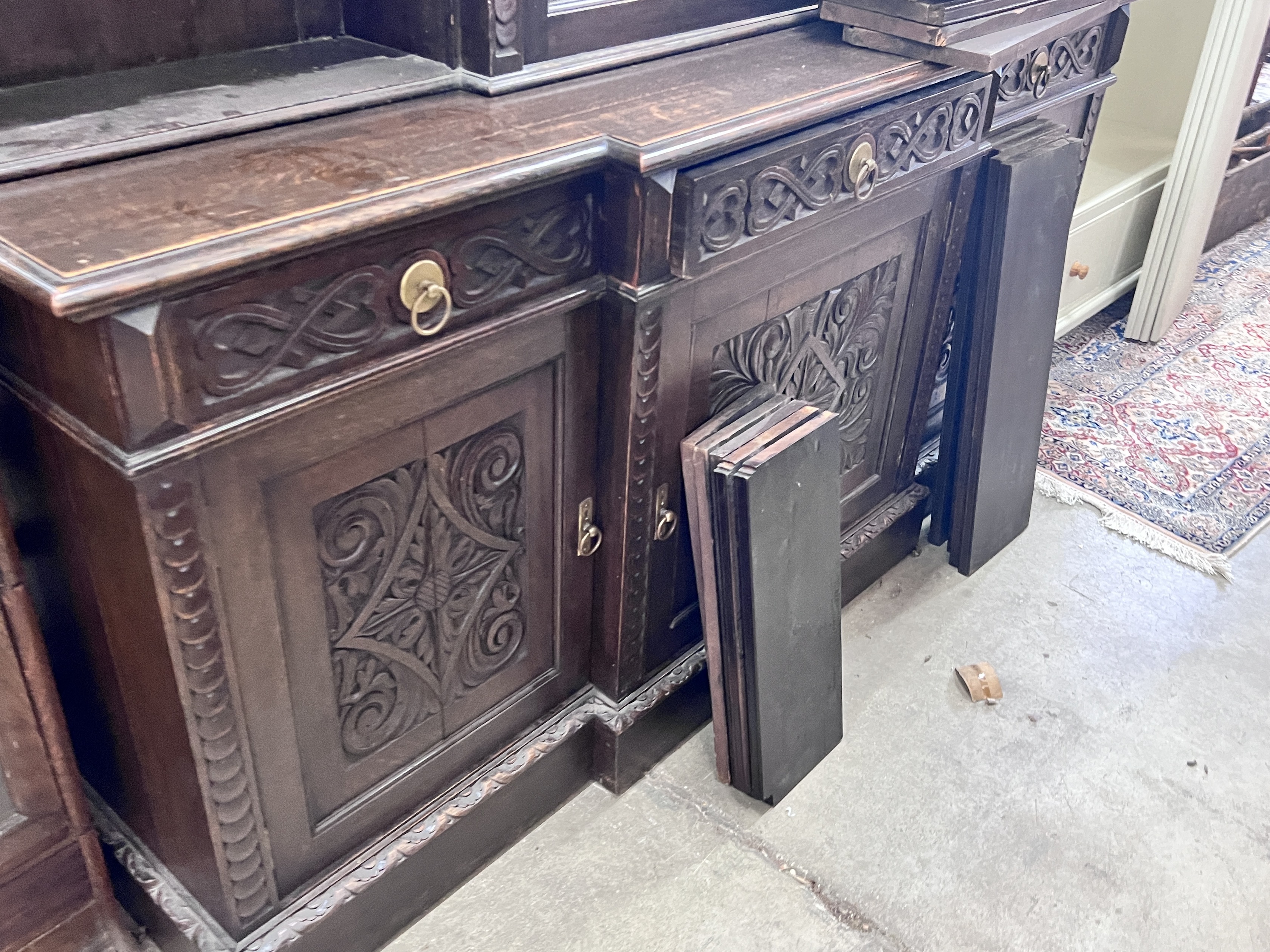 An early 20th century carved oak breakfront library bookcase, width 206cm, depth 54cm, height 260cm